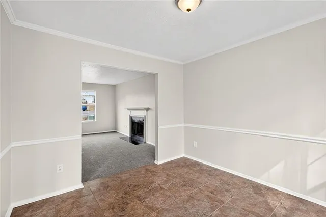 a view of a kitchen with a sink and a refrigerator