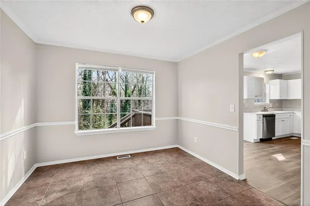 a view of a kitchen with a sink and cabinets