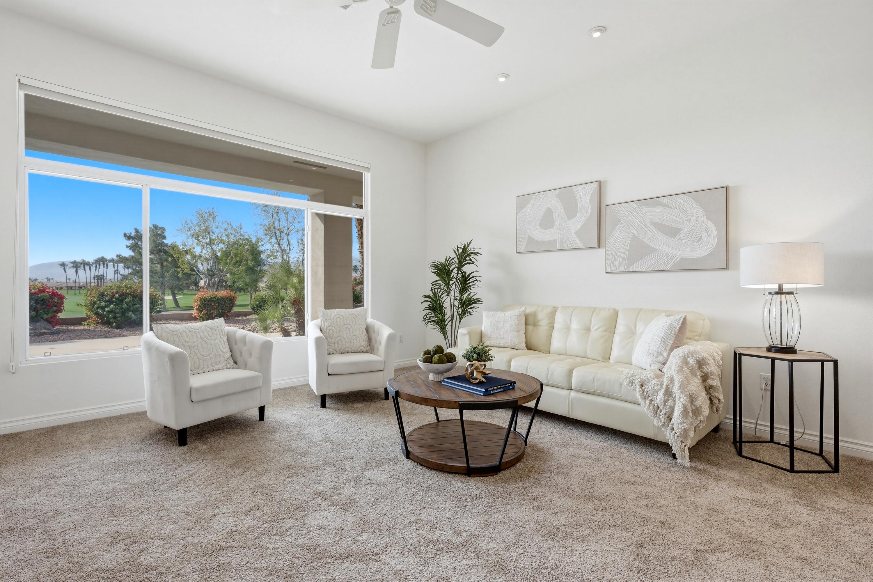 35440 Moorbrook Road Palm Desert, CA 92211 - Photo 11 of 32 a living room with furniture and a large window