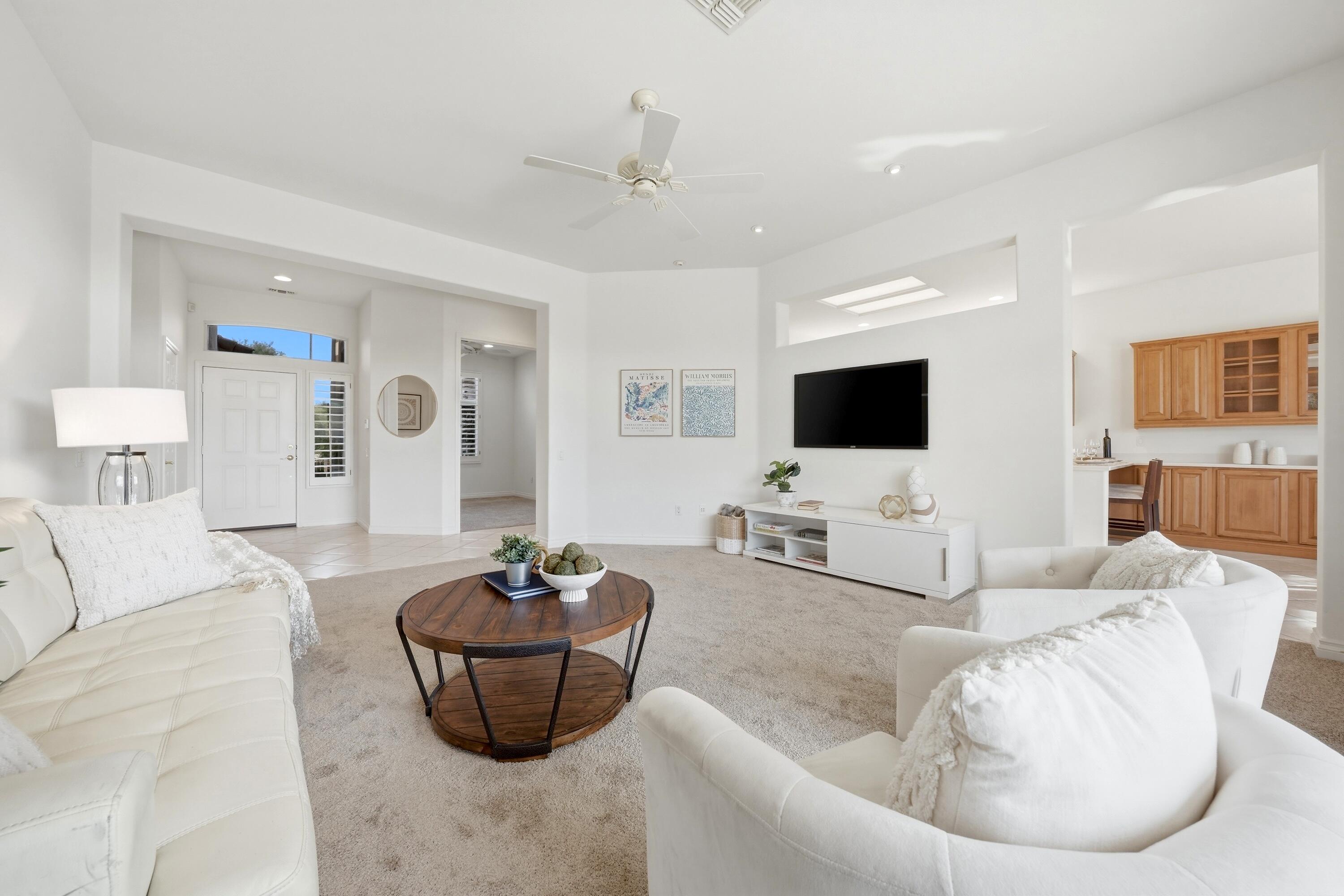 35440 Moorbrook Road Palm Desert, CA 92211 - Photo 13 of 32 a living room with furniture and a flat screen tv
