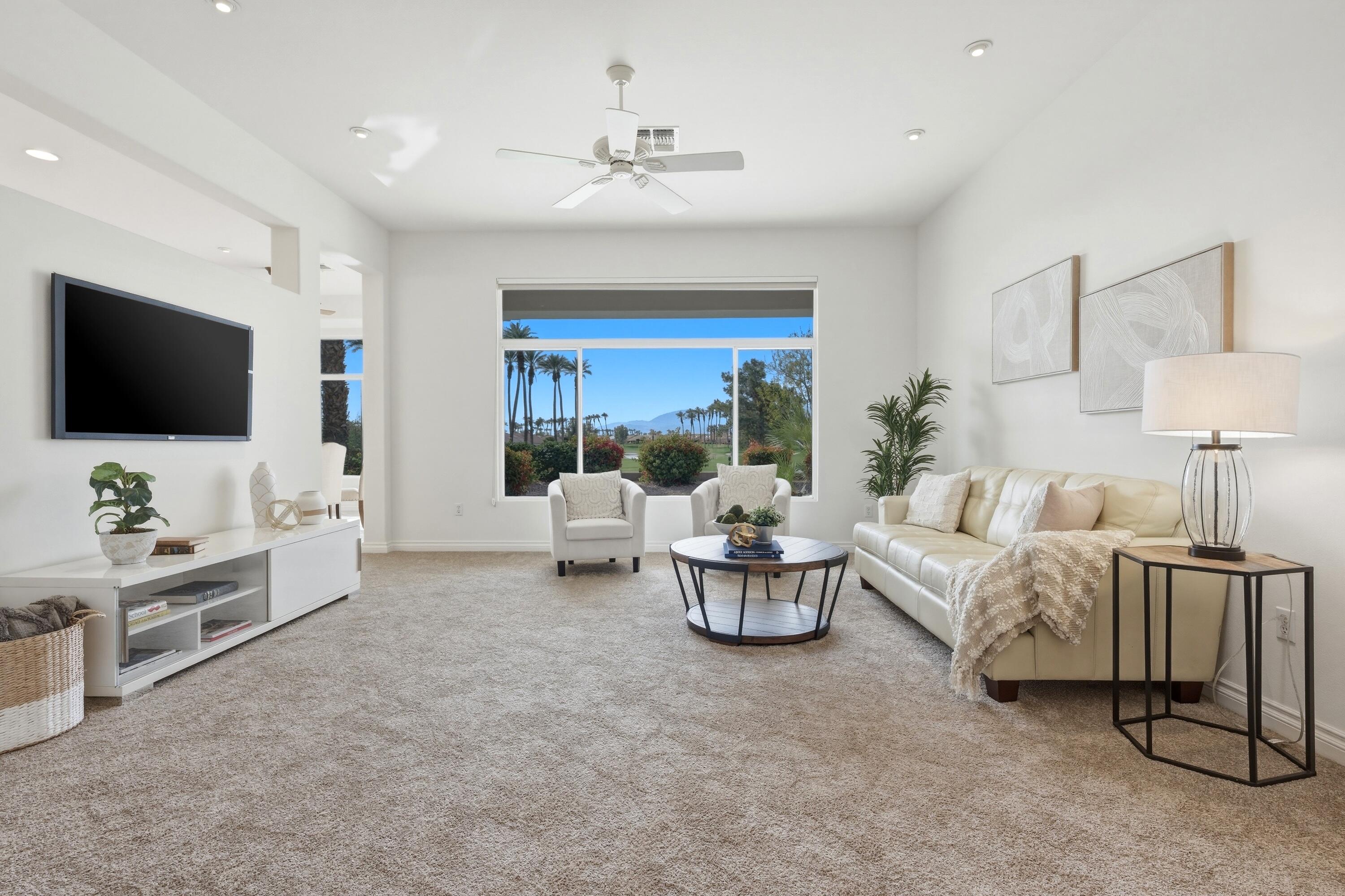 35440 Moorbrook Road Palm Desert, CA 92211 - Photo 10 of 32 a living room with furniture and a flat screen tv
