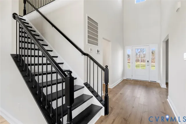 a view of an entryway with wooden floor