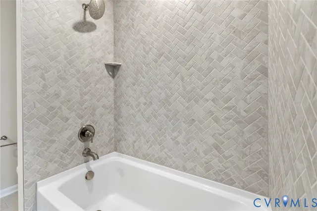 a bathroom with a white bath tub