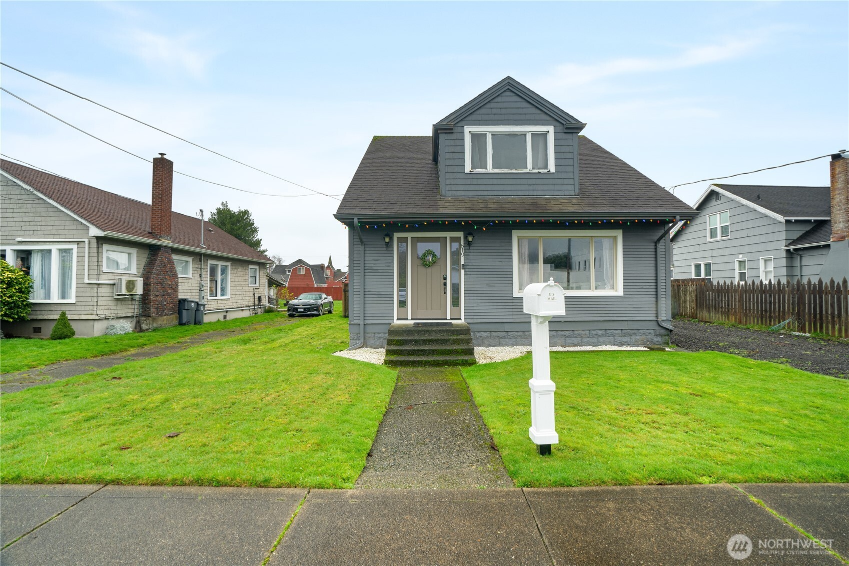 619 Spruce Street Hoquiam, WA 98550 - Photo 1 of 30 a front view of a house with yard and green space