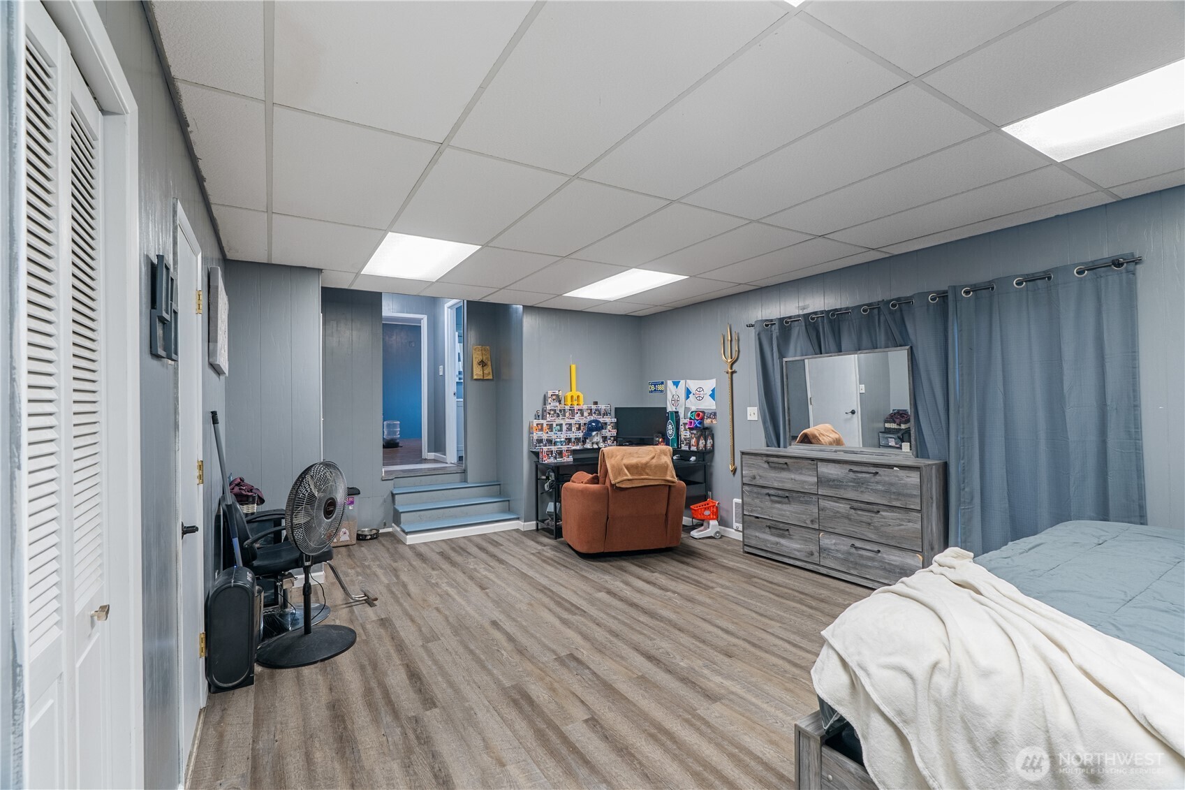 619 Spruce Street Hoquiam, WA 98550 - Photo 17 of 30 a bedroom with furniture and a wooden floor