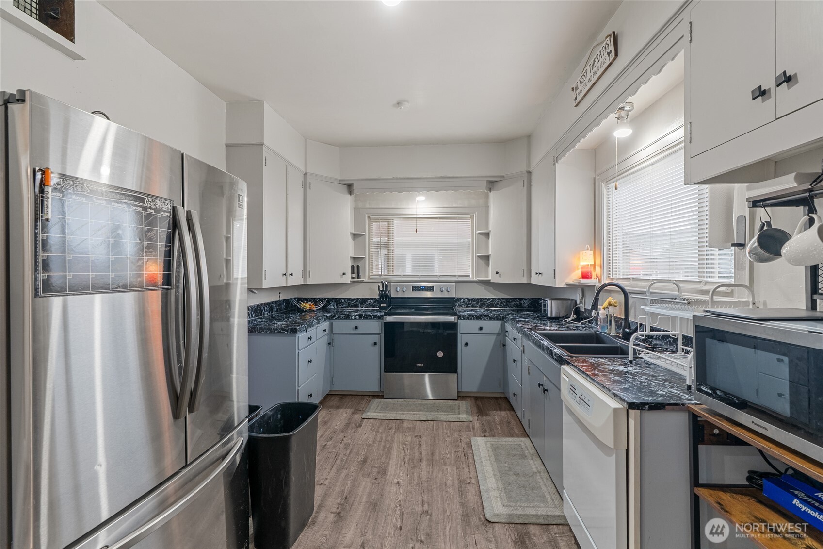 619 Spruce Street Hoquiam, WA 98550 - Photo 6 of 30 a kitchen with a refrigerator stove and sink