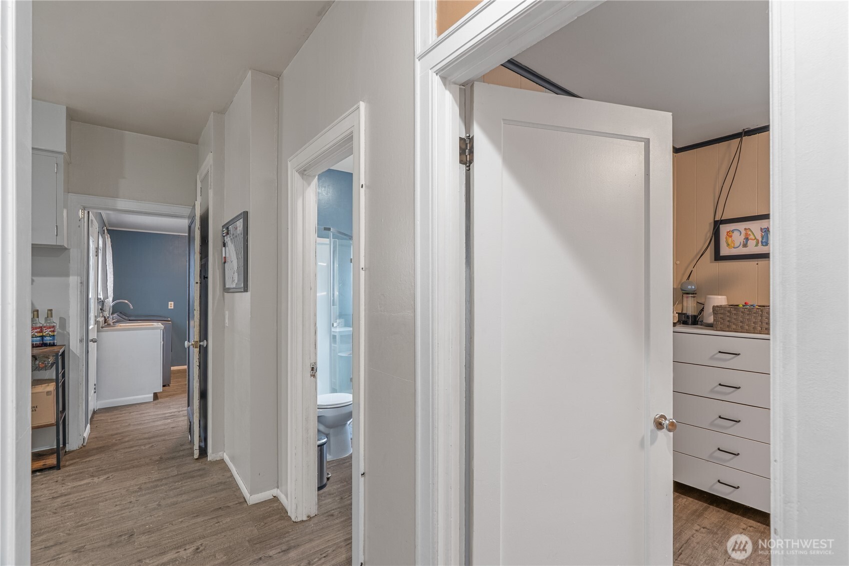 619 Spruce Street Hoquiam, WA 98550 - Photo 8 of 30 a view of a hallway with closet and a living room