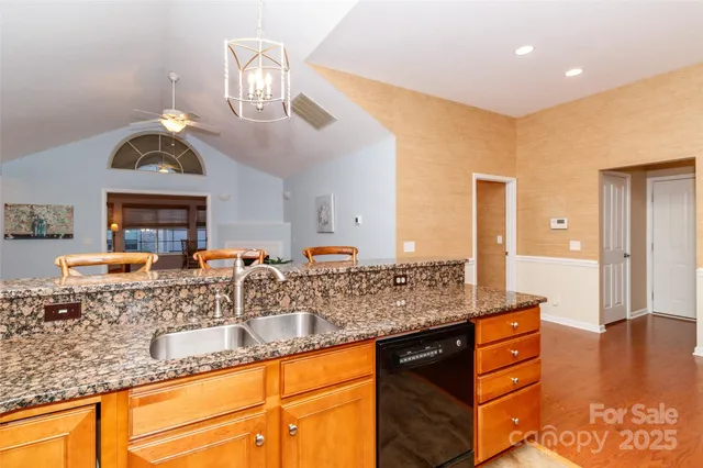 a view of living room with granite countertop furniture and fireplace