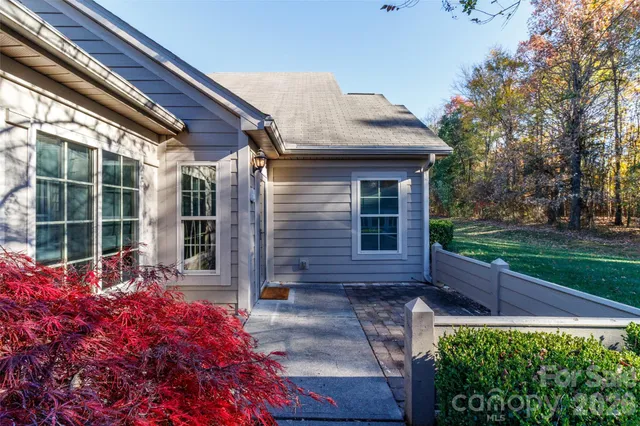 a view of an empty room with a fireplace