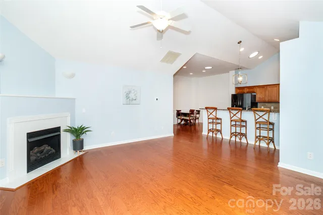 a view of a kitchen with dining table and chairs
