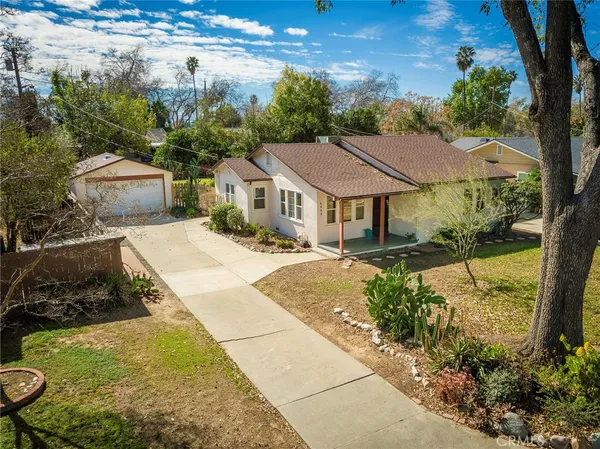 a house with trees in the background