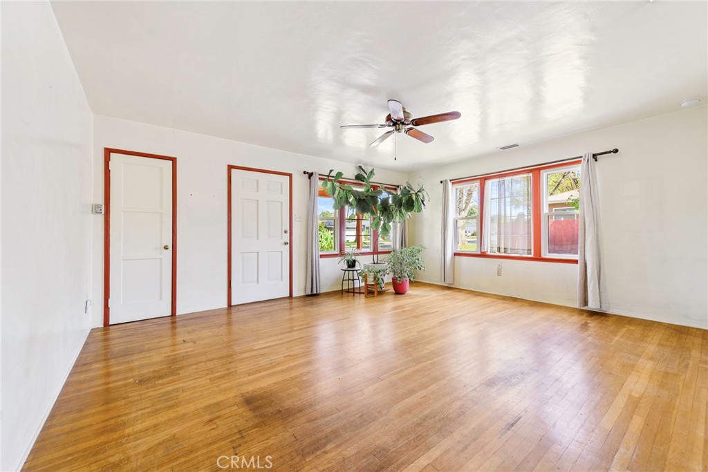 4660 Cover Street Riverside, CA 92506 - Photo 14 of 45 a view of n empty room with window and wooden floor