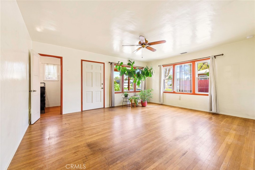 4660 Cover Street Riverside, CA 92506 - Photo 15 of 45 a view of n empty room with window and wooden floor