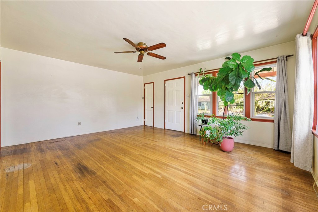 4660 Cover Street Riverside, CA 92506 - Photo 16 of 45 a view of a big room with wooden floor and a chandelier