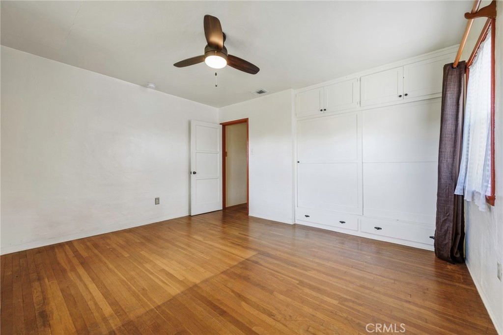 4660 Cover Street Riverside, CA 92506 - Photo 20 of 45 a view of empty room with wooden floor and fan