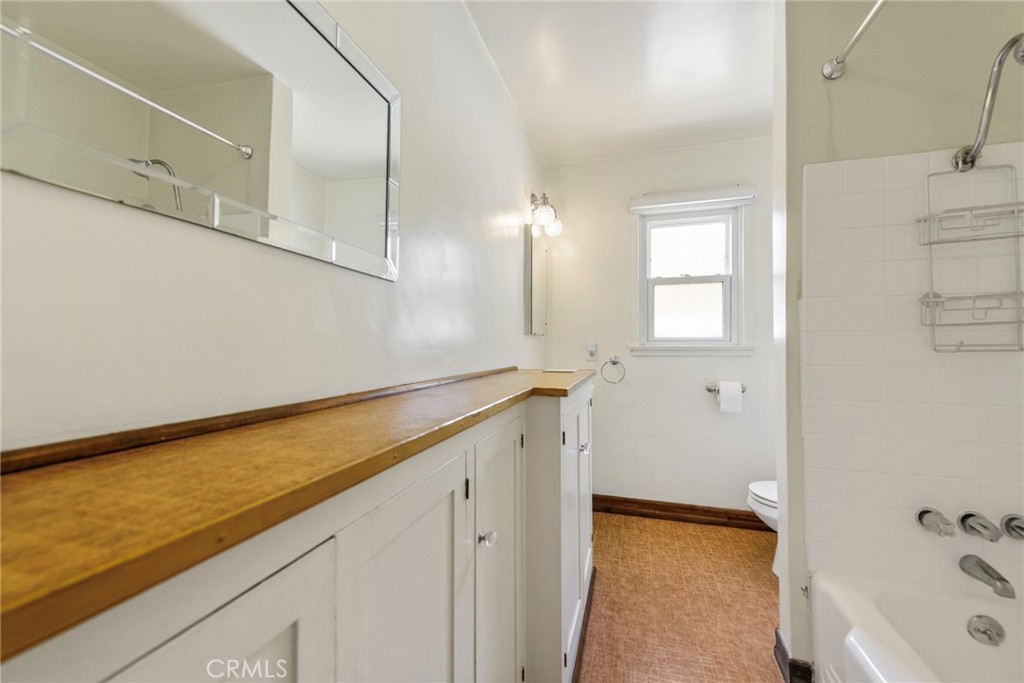 4660 Cover Street Riverside, CA 92506 - Photo 22 of 45 a bathroom with a bathtub and a sink