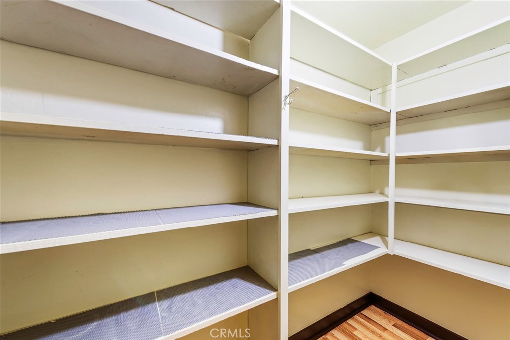 4660 Cover Street Riverside, CA 92506 - Photo 28 of 45 a room with a closet and wooden floor