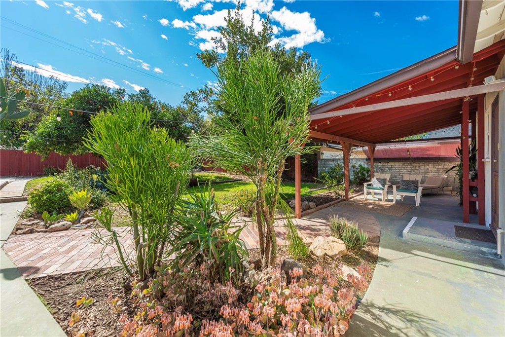 4660 Cover Street Riverside, CA 92506 - Photo 33 of 45 a view of a patio with table and chairs and potted plants