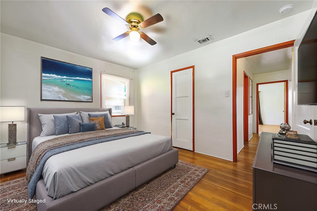 4660 Cover Street Riverside, CA 92506 - Photo 10 of 45 a bedroom with a bed and a chandelier