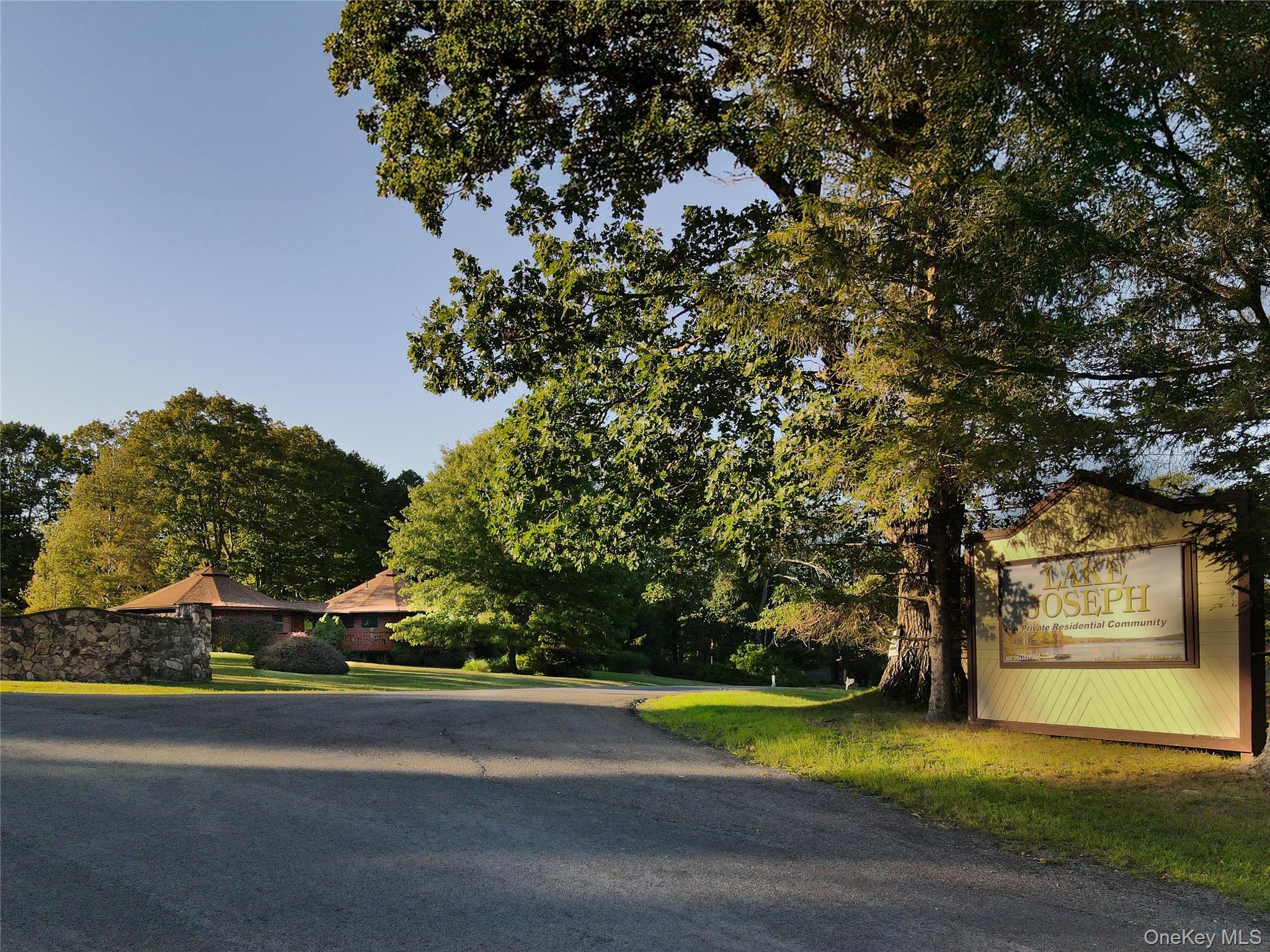 2 Lena Road Forestburgh, NY 12777 - Photo 7 of 9 a front view of a house with a yard and garage