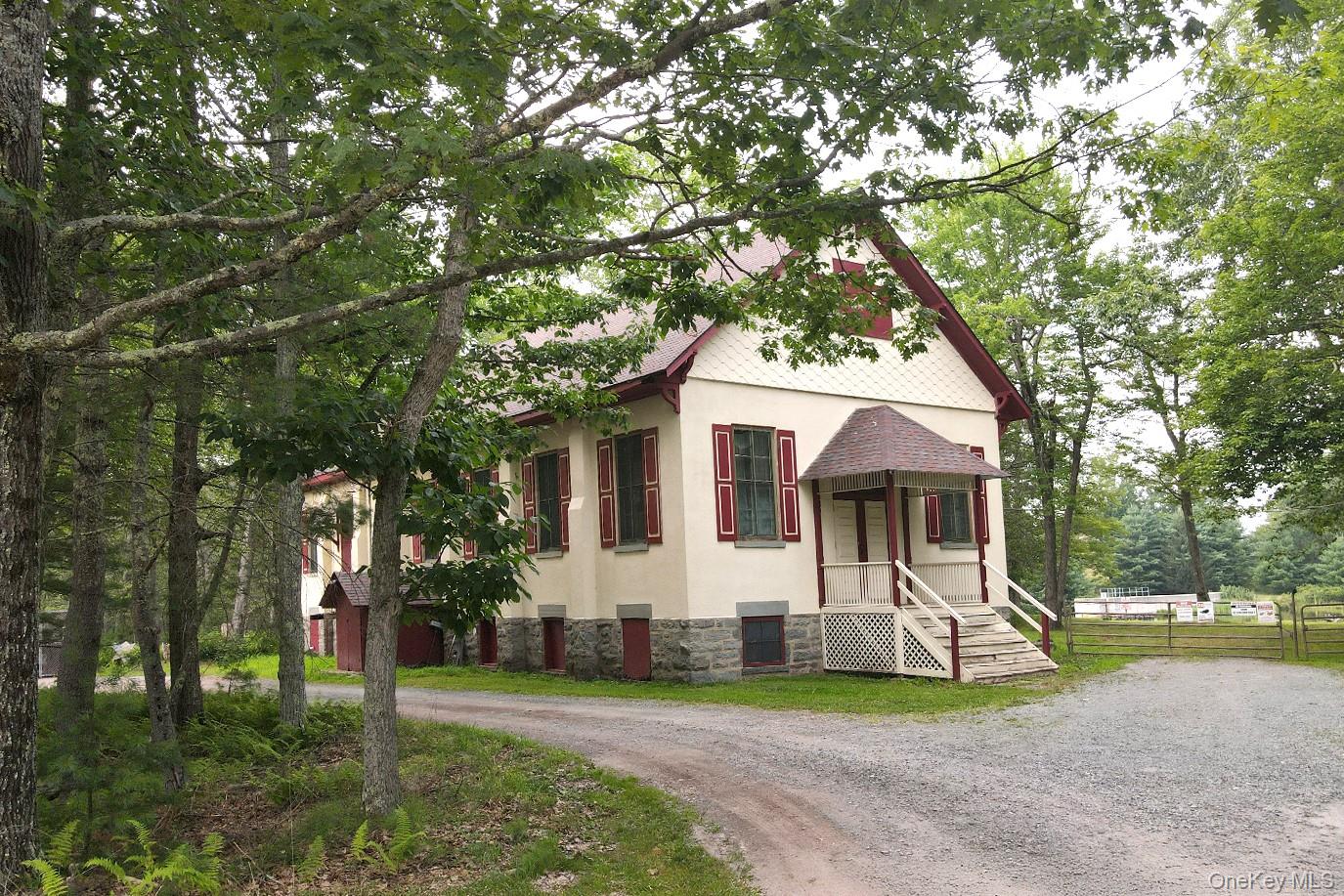 2 Lena Road Forestburgh, NY 12777 - Photo 8 of 9 a front view of a house with a garden and trees