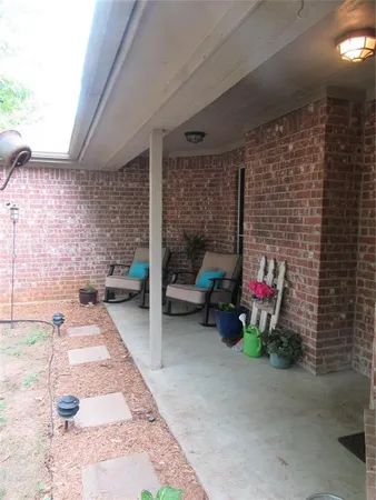 a backyard of a house with seating space