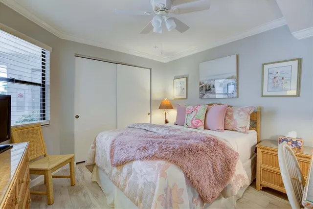 a bedroom with a bed and a chair