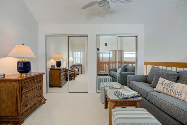 a living room with furniture and a lamp