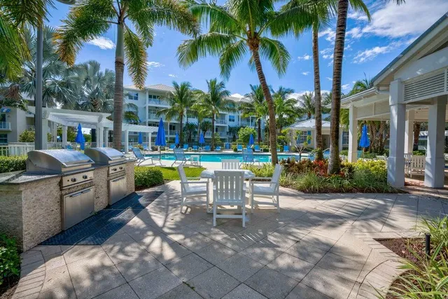 a view of a swimming pool with chairs