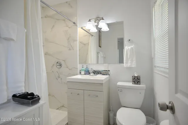 a bedroom with a bed and a walk in closet