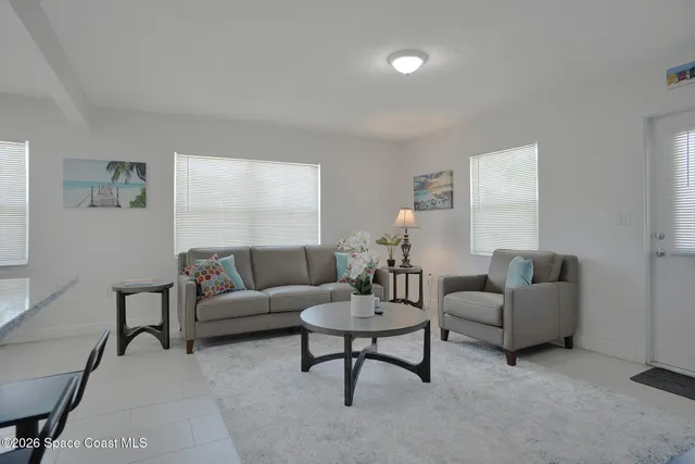 a kitchen with white cabinets stainless steel appliances and sink