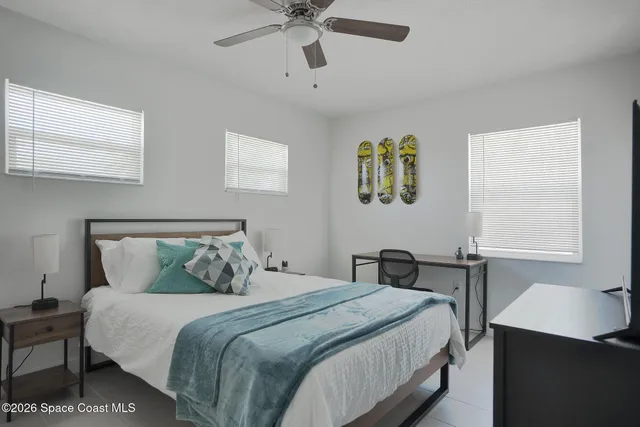 a view of backyard with outdoor seating and plants