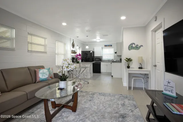a kitchen with granite countertop a sink a counter space appliances and cabinets