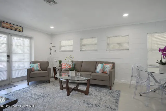 a kitchen with granite countertop a refrigerator stove and sink