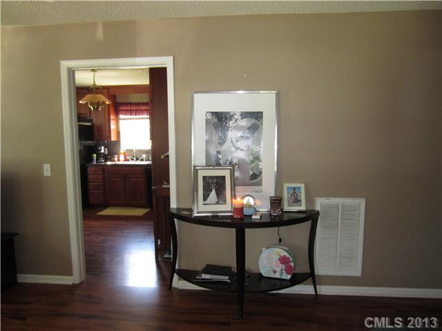 20116 Walter Henderson Road Cornelius, NC 28031 - Photo 6 of 15 a view of a dining room with furniture and wooden floor