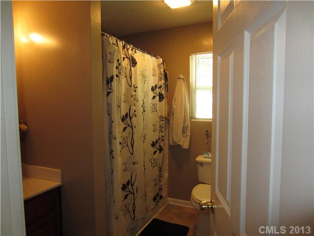 20116 Walter Henderson Road Cornelius, NC 28031 - Photo 10 of 15 a bathroom with a shower and a toilet