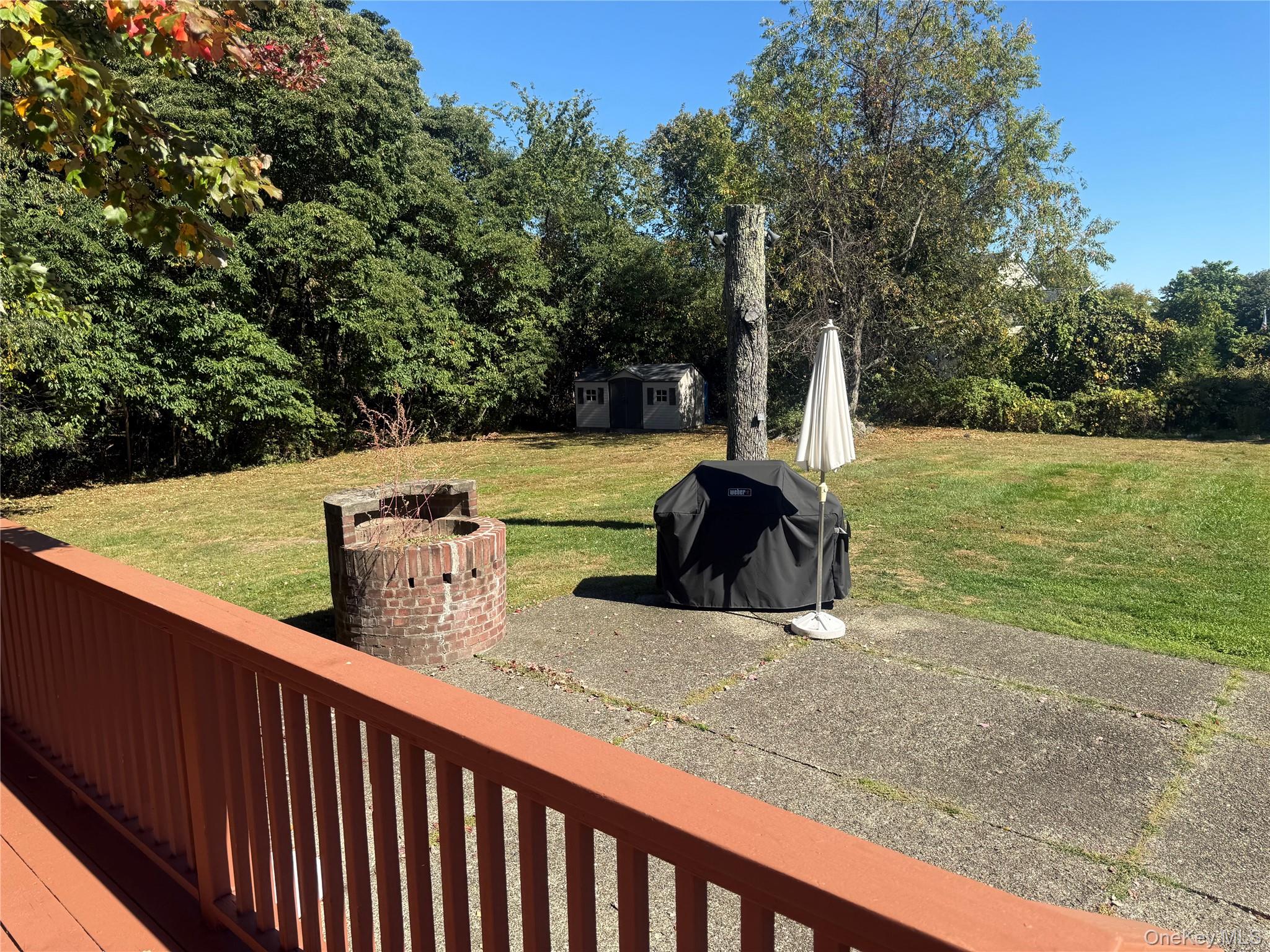 18 Adams Road Ossining, NY 10562 - Photo 21 of 41 Wooden deck featuring a shed, area for grilling, and a yard