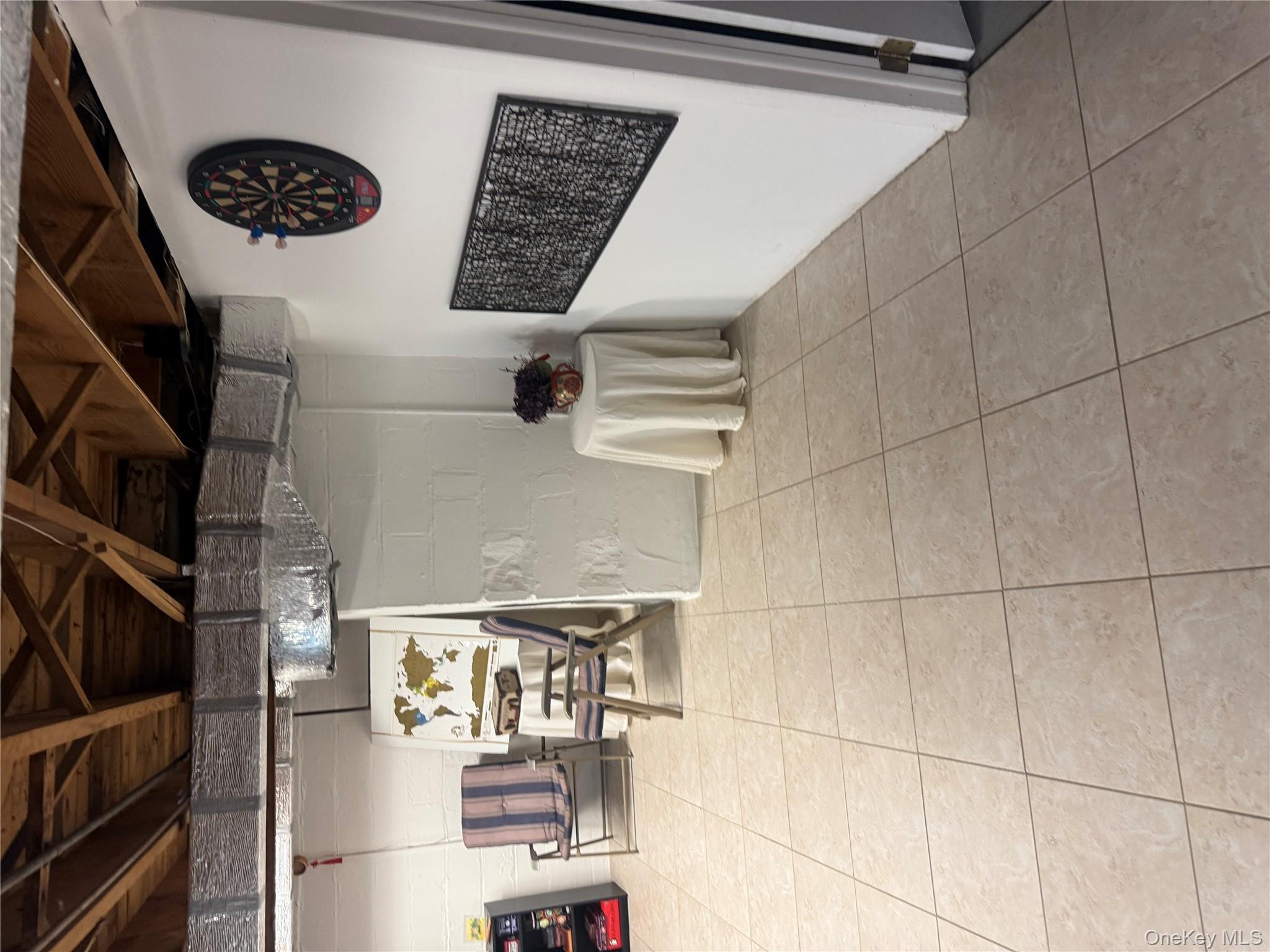 18 Adams Road Ossining, NY 10562 - Photo 27 of 41 Below grade area with concrete block wall and light tile patterned floors