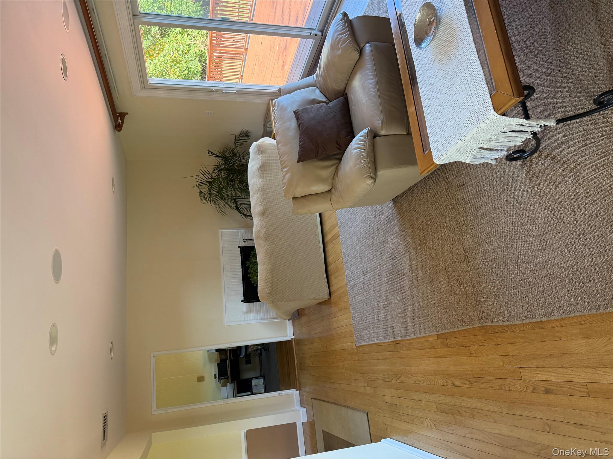 18 Adams Road Ossining, NY 10562 - Photo 7 of 41 Living room with light wood-style floors and baseboards