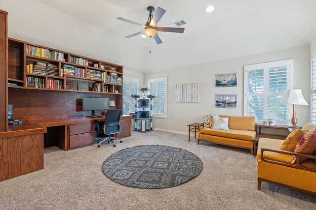a living room with furniture workspace and a window