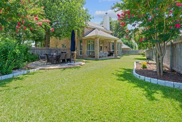 a front view of house with yard and seating area