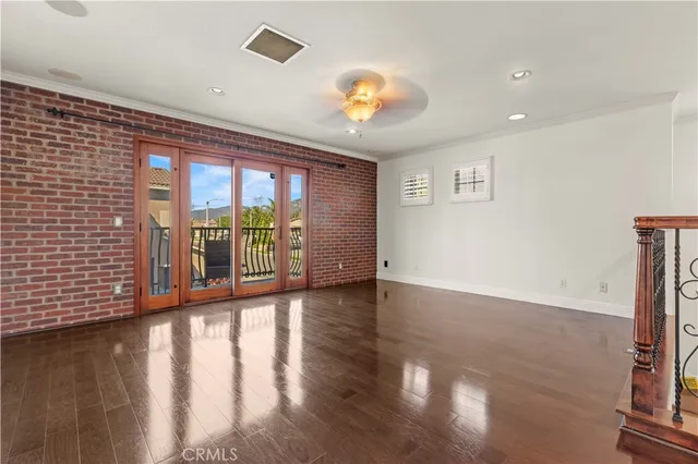 a view of an entryway with wooden floor