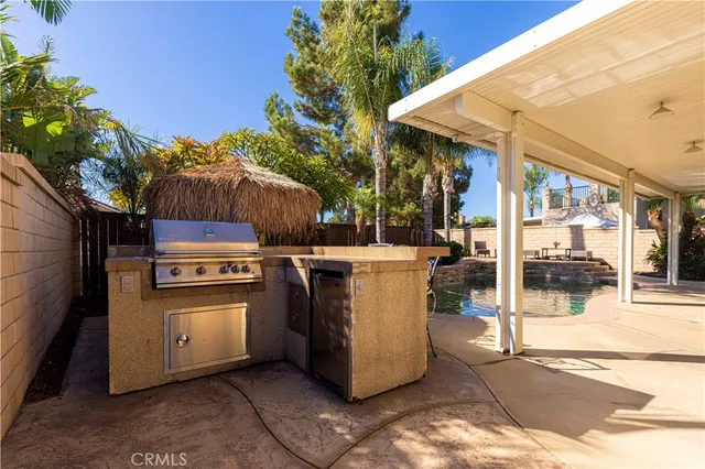a view of a kitchen with outdoor kitchen