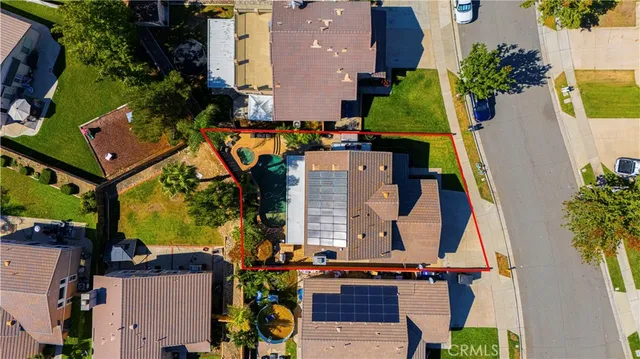 an aerial view of houses with trees