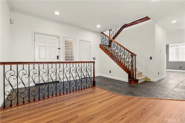 a view of staircase with wooden floor and stairs