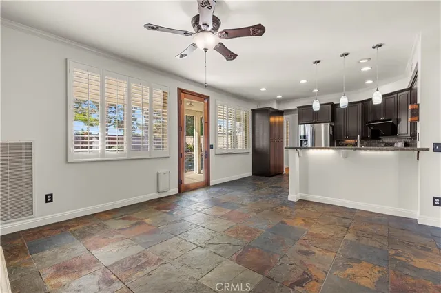 a view of a kitchen with furniture and a window