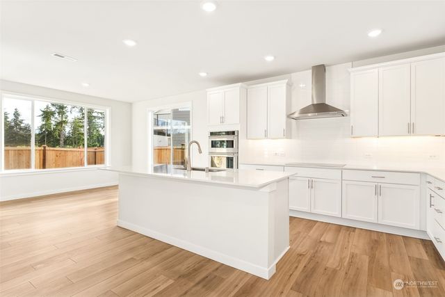 a bathroom with a sink double vanity granite tub and shower