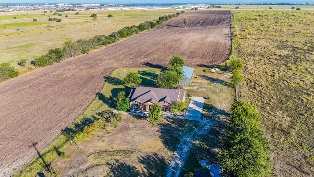 a view of an outdoor space with garden and ocean view