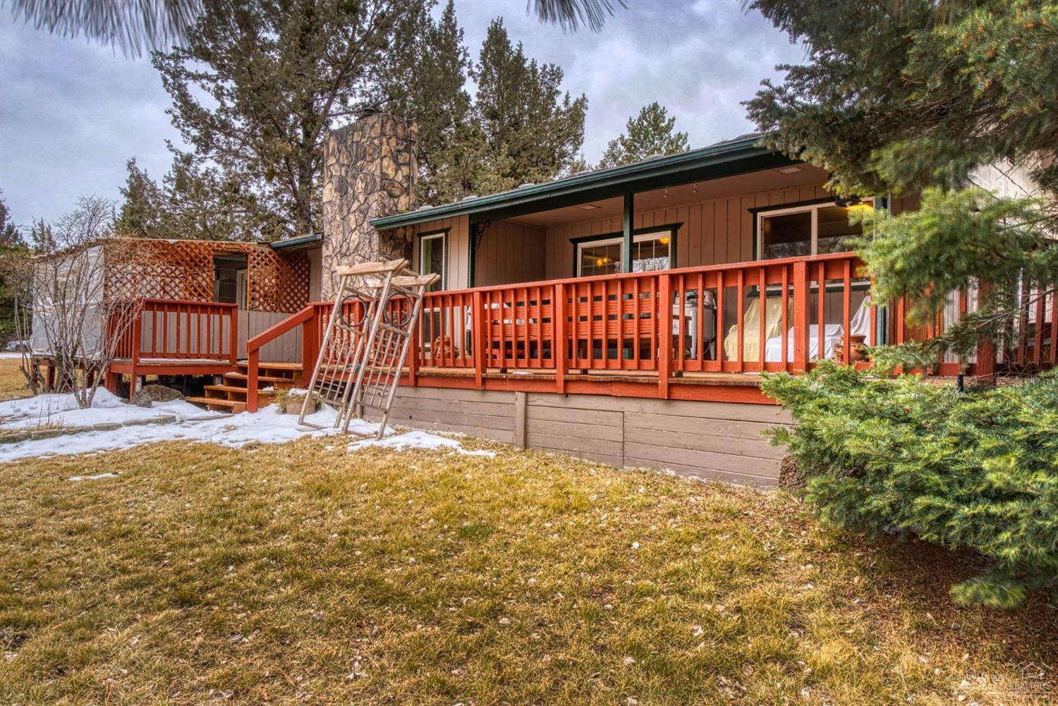 21452 Keyte Lane Bend, OR 97701 - Photo 24 of 25 Back view showing railed decking, stone