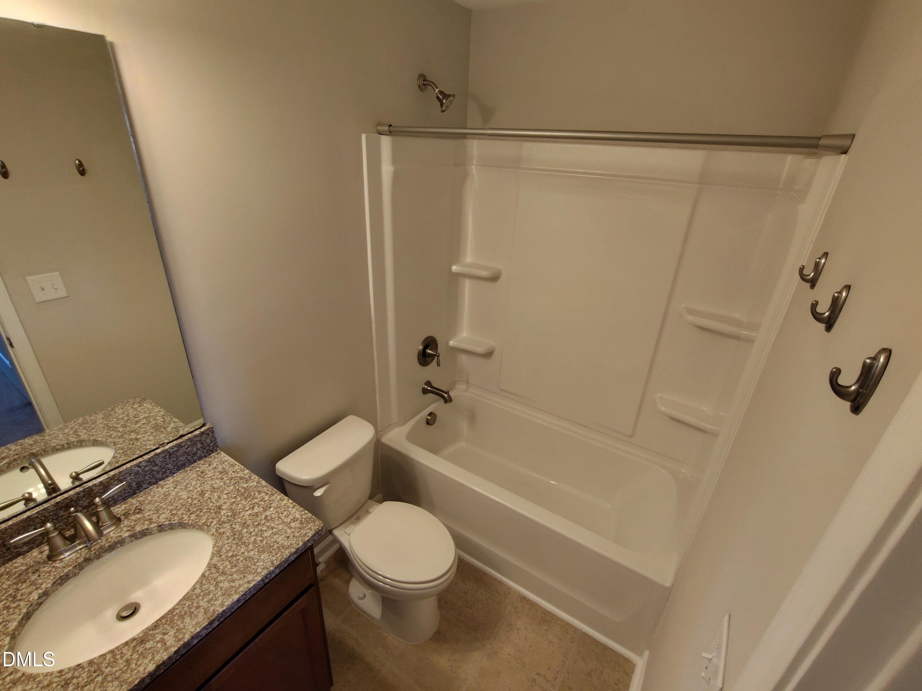 1013 Kudzu Street Durham, NC 27713 - Photo 15 of 21 a bathroom with a granite countertop sink toilet and shower